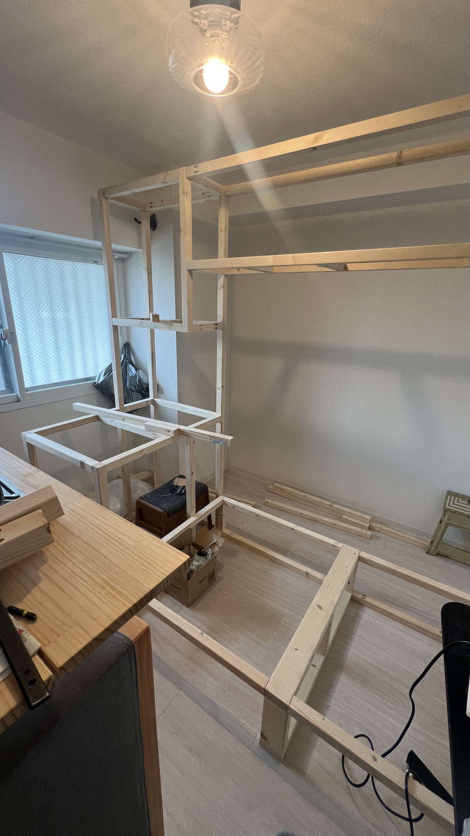 The frame assembled — the skeleton standing, before any surfaces or drawers